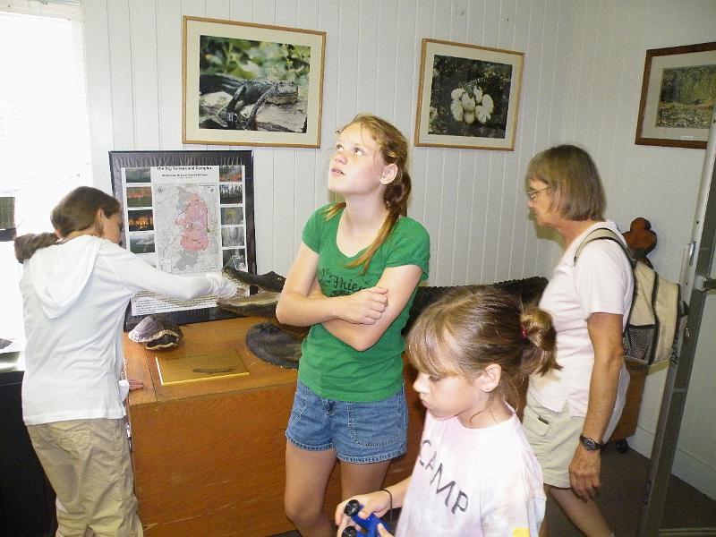 6-museum.JPG - Andrea tries her hand in the alligator's mouth.