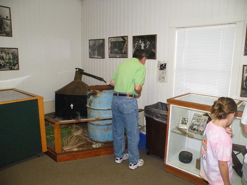 9-museum.JPG - Dr. Bedoya learns how to make a moonshine still.